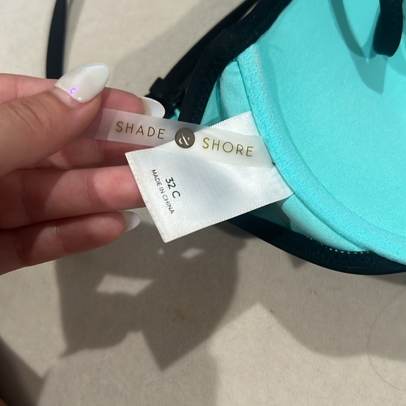 teal bathing suit with black designs on cup criss cross back with black strings - Picture 2 of 4